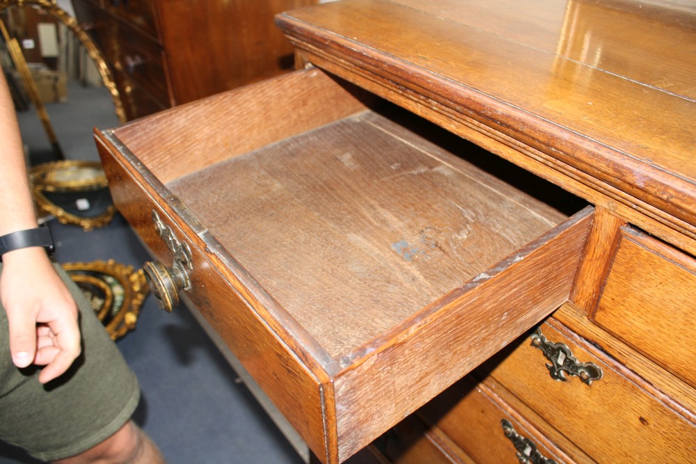 A 19th century panelled oak chest of drawers, W.103cm D.56cm H.112cm